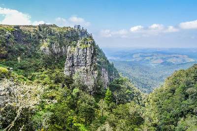 Pinnacle Rock quartzite formation overlooking forested escarpment valleys near Graskop on the Panorama Route, Mpumalanga, South Africa.