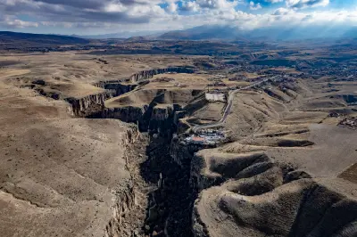 Deep Ihlara Valley canyon winding through the arid plateau of Aksaray Province, Turkey.