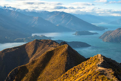 View from Roys Peak Track overlooking Lake Wanaka and the surrounding Southern Alps, Otago, South Island, New Zealand.