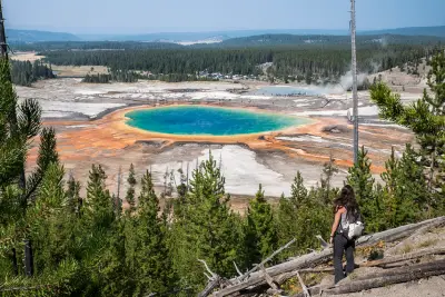 Grand Prismatic Spring overlook with hiker Yellowstone