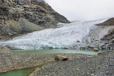 Glacier terminus with meltwater lagoon in Vanoise National Park, French Alps