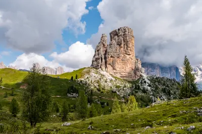 Cinque Torri in the Alps, showing the distinctive rock towers rising from alpine terrain in the Dolomites, Italy.