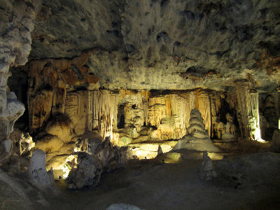 Illuminated stalactites and limestone cave formations inside the Rainbow Chamber of the Cango Caves near Oudtshoorn in South Africa.
