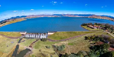 Aerial panorama of Midmar Dam showing the dam wall, reservoir and surrounding countryside near Howick in KwaZulu-Natal.