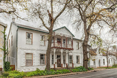 Historic whitewashed buildings and traditional Cape Dutch architecture along Dorp Street in Stellenbosch town centre, Western Cape, South Africa.