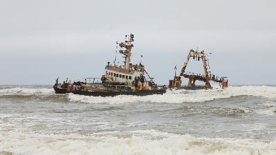 Rusting Zeila shipwreck listing in the Atlantic Ocean off Namibia’s Skeleton Coast near Henties Bay.