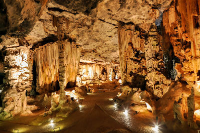 Large limestone stalactite formations inside the illuminated Cango Caves near Oudtshoorn in the Klein Karoo region of South Africa.