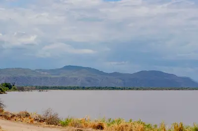 Wide view of Lake Manyara with the Great Rift Valley escarpment rising beyond the lake in northern Tanzania.