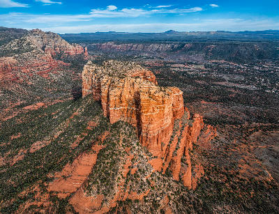 Drone view of Cathedral Rock’s red sandstone cliffs and surrounding high desert terrain near Sedona, Northern Arizona.