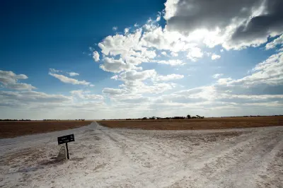 Road junction leading to the Baobab Loop across the open plains of Nxai Pan, Botswana.