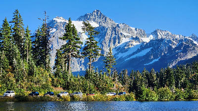 Mount Shuksan rising above Picture Lake with golden autumn trees and calm reflection in the Mount Baker region, Washington State