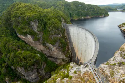 Gordon Dam spanning a steep wilderness gorge above Lake Gordon in southwest Tasmania.