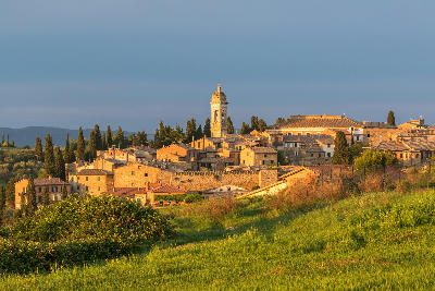 San Quirico d'Orcia, an Italian village in Tuscany at sunset