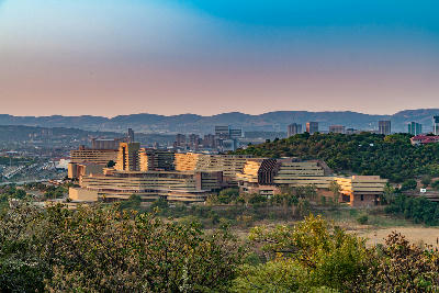 View of the UNISA campus and Pretoria skyline from Fort Klapperkop Nature Reserve during late afternoon in Gauteng, South Africa.