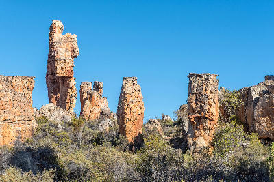 Towering sandstone pillars and weathered rock columns along the Vensterklippe Trail near Dwarsrivier in the Cederberg Mountains, Western Cape, South Africa.