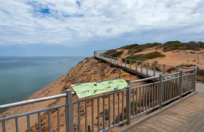 Boardwalk and interpretive sign follow the clifftop at Eagle Bluff above the waters of Shark Bay.