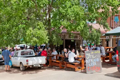 Visitors enjoying outdoor seating at a café and brewery in Clarens, a popular arts and tourism town in South Africa's Eastern Highlands.