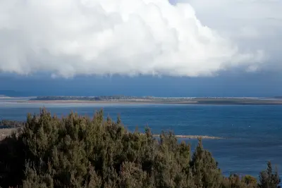 Great Lake beneath dramatic storm clouds on Tasmania’s Central Plateau, Australia.