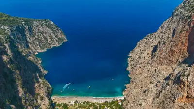 Elevated view of Butterfly Valley and its secluded beach on the Turquoise Coast near Ölüdeniz, Türkiye.