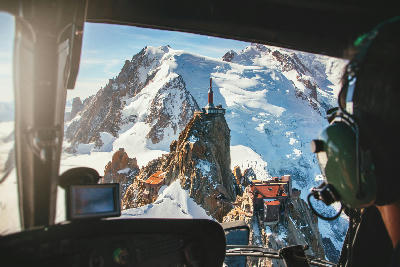 Aerial view of Aiguille du Midi above glaciers in the Mont Blanc Massif from a helicopter.