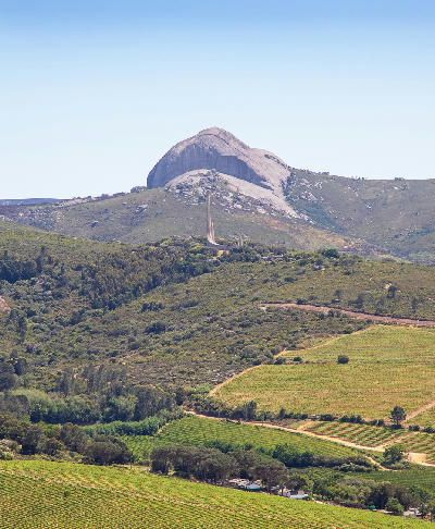 Afrikaans Language Monument with Paarl Rock and surrounding vineyards in the Paarl wine region of South Africa.