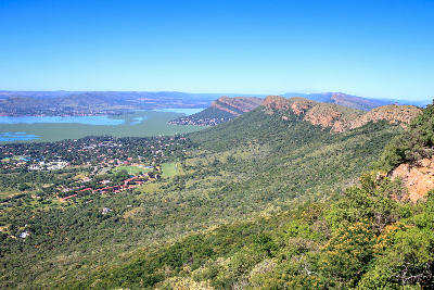 Panoramic view of Hartbeespoort Dam, surrounding valleys and the Magaliesberg mountain range in North West Province, South Africa.