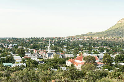 Elevated view of Graaff-Reinet with the Dutch Reformed Church rising above the historic Karoo town and surrounding hills.