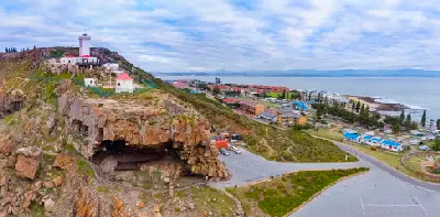 Cape St. Blaize Lighthouse above the rocky cliffs of Mossel Bay overlooking the Indian Ocean