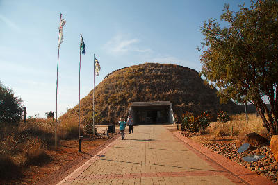Visitors walk towards the grass-covered Maropeng Visitor Centre, the main interpretive centre of the Cradle of Humankind World Heritage Site in Gauteng, South Africa.
