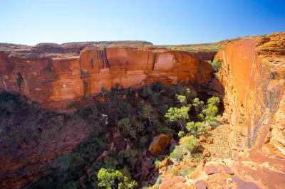 View from the cliff edge across the sheer red sandstone walls and gorge of Kings Canyon, Northern Territory, Australia.