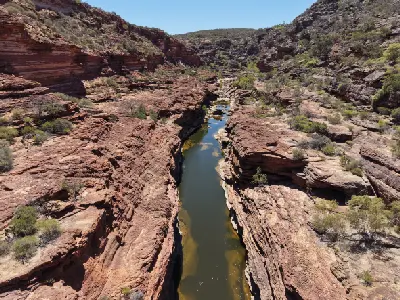 Aerial view along the narrow Murchison River channel between steep red sandstone walls at Z Bend.