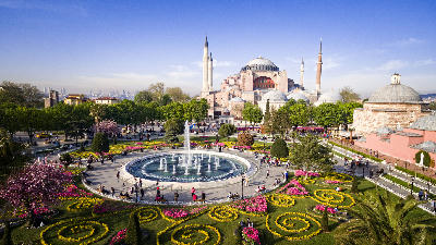 Hagia Sophia overlooking the fountain and colourful flower gardens of Sultanahmet Square in Istanbul.