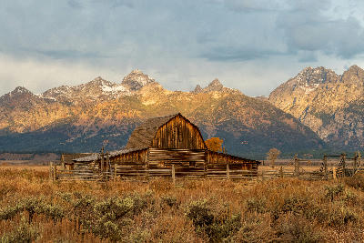 T.A. Moulton Barn with the Teton Range in Grand Teton National Park at sunrise.