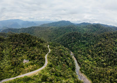Aerial view of rainforest mountains and river valleys in Ranomafana National Park in Madagascar’s eastern highlands