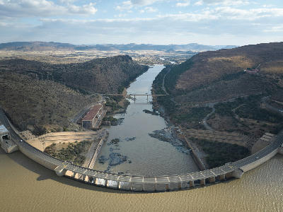 Aerial view of Gariep Dam and the Orange River flowing through a rocky valley below South Africa's largest dam.