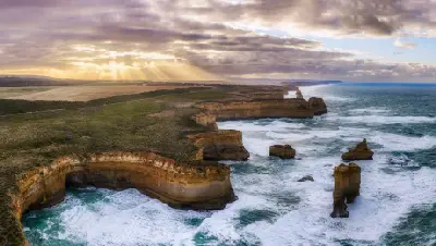 Aerial view of limestone cliffs, offshore sea stacks and rough Southern Ocean along Victoria’s Shipwreck Coast.