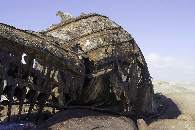 Detail of the heavily corroded Aristea shipwreck resting on coastal rocks at Hondeklip Bay, Namaqualand, South Africa.