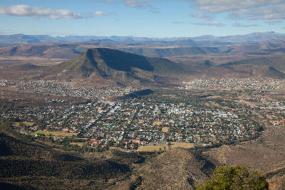 Aerial view of Graaff-Reinet surrounded by Karoo mountains and semi-arid landscapes in the Eastern Cape, South Africa.
