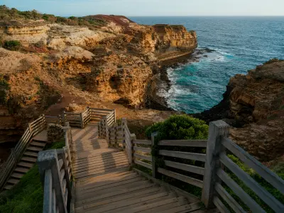 Wooden steps descending toward The Grotto and the Southern Ocean on Victoria’s Great Ocean Road.