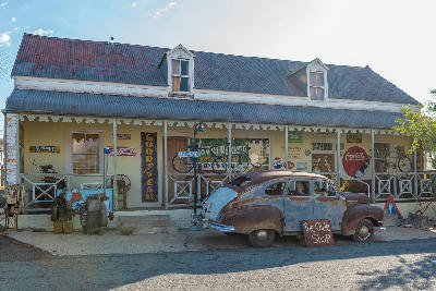 Historic roadside antique shop with vintage car in Prince Albert in the Great Karoo region of South Africa.