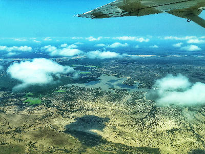Aerial view of wetlands and savanna in Mikumi National Park, Tanzania, seen from a light aircraft above the park.