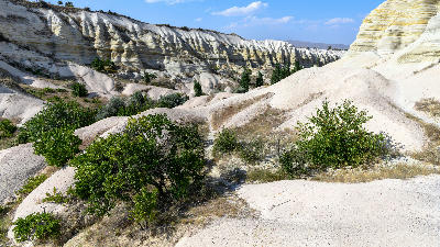 White volcanic rock formations and a hiking trail through White Valley, Cappadocia, Turkey.