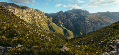 Rocky mountain slopes and green valley in Jonkershoek Nature Reserve near Stellenbosch, Cape Winelands, Western Cape, South Africa.