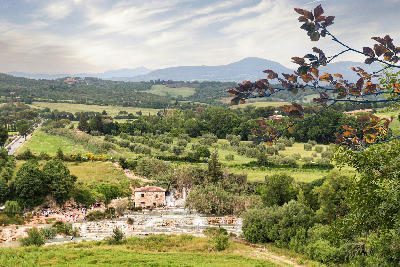 Panoramic view of Cascate del Mulino, showing terraced thermal pools and waterfalls near Saturnia in the Province of Grosseto, Tuscany, Italy.