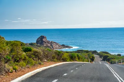 Coastal road approaching Cape Naturaliste and the Indian Ocean in the Margaret River region, Western Australia.
