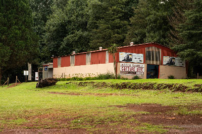 Exterior of the Nelson Mandela Capture Site Museum near Howick, surrounded by lawns and forest in the KwaZulu-Natal Midlands.