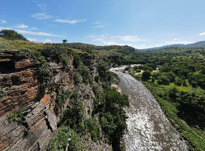 Aerial view of the Crocodile River flowing through a steep rocky gorge surrounded by green vegetation in the Magaliesberg near Hartbeespoort.