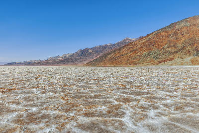 Badwater Basin salt flats with mountains Death Valley California