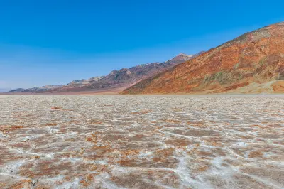 Badwater Basin salt flats with mountains Death Valley California