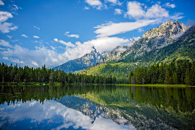 Grand Teton peaks reflected in String Lake within the Alpine Lakes system in Wyoming.